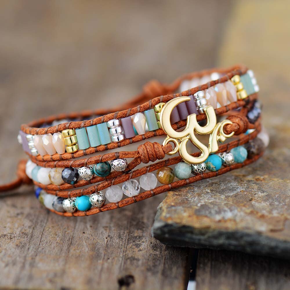 LEATHER WRAP BRACELET WITH STONES AND OM CHARM