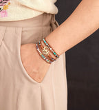 LEATHER WRAP BRACELET WITH STONES AND OM CHARM